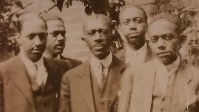 Hogansville, Ga., postmaster Isaiah Lofton (center) and his four sons. The Ku Klux Klan in Hogansville tried to kill Lofton. He later moved to Washington, D.C. CONTRIBUTED