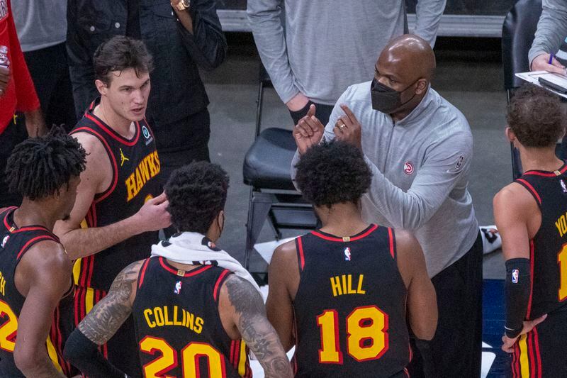 Hawks assistant coach Nate McMillan - standing for coach Lloyd Pierce - speaks with the team during a time out against the Denver Nuggets during the second quarter Sunday, Feb. 21, 2021, at State Farm Arena in Atlanta. (Alyssa Pointer / Alyssa.Pointer@ajc.com)