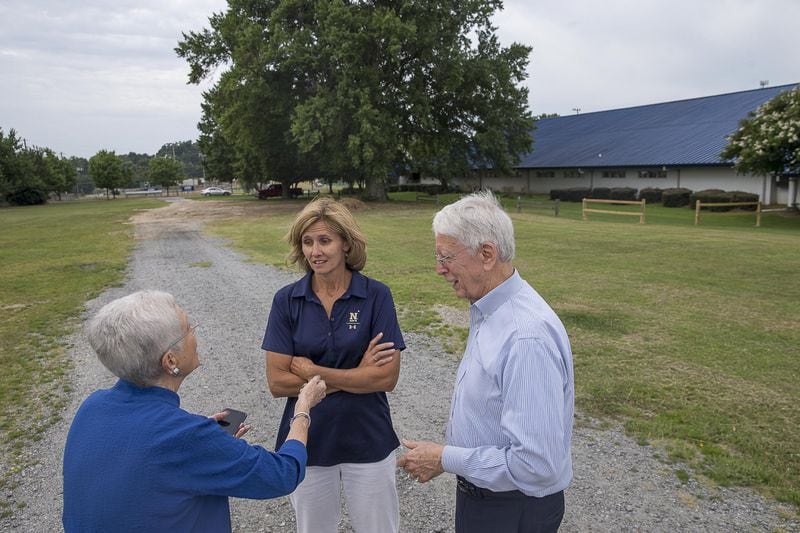 7/3/2019 — Marietta, Georgia — Army Veteran Captain Nurse Corp. Donna Rowe (left), Navy Veteran Lt. Commander Shelley O’Malley (center) and Army Veteran Bob Moreland (right), board members of the Cobb County Veterans Memorial Foundation, Inc., talk amongst themselves near the Cobb County Aquatic Center in Marietta, Wednesday, July 3, 2019. This area is the future site of the Cobb County Veterans Memorial. (Alyssa Pointer/alyssa.pointer@ajc.com)