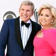 FILE - Todd Chrisley, left, and his wife, Julie Chrisley, pose for photos at the 52nd annual Academy of Country Music Awards on April 2, 2017, in Las Vegas. The Chrisleys, who are in prison after being convicted on federal charges of bank fraud and tax evasion, are appealing aspects of their convictions and sentences. (Photo by Jordan Strauss/Invision/AP, File)