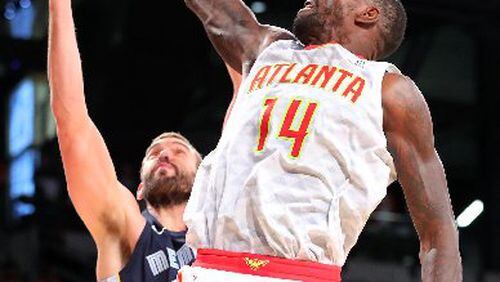 Dewayne Dedmon can grab offensive boards but the Hawks prioritize getting back on D. (Curtis Compton/ccompton@ajc.com)