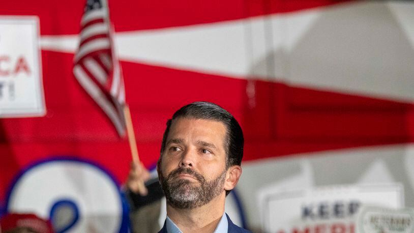 Donald Trump Jr. spoke at a rally outside the Georgia Republican Party Headquarters in Buckhead on Nov. 5, 2020. That same day, he threatened to "tank" the U.S. Senate runoff impending elections if the party didn't support his father's voting fraud allegations, according to congressional testimony released Friday. (Alyssa Pointer / Alyssa.Pointer@ajc.com)