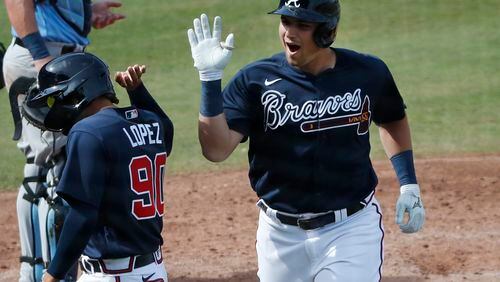 Atlanta Braves' Austin Riley celebrates his two-run homer during a spring training baseball game against the Tampa Bay Rays, Tuesday, March 3, 2020, in Venice, Fla. (AP Photo/Elise Amendola)