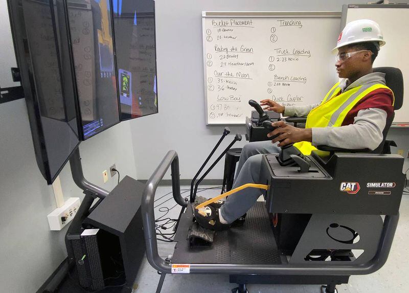 Greg Owens, 17, a senior at Jordan Vocational High School, works on a CAT Simulator as part of the school’s Heavy Equipment Operator Training Program. (Photo Courtesy of Mike Haskey mhaskey@ledger-enquirer.com)