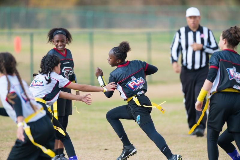 Girls in this NFL camp are playing flag football. In a program starting this fall, all 20 Gwinnett County public high schools will have girls flag football teams that will compete against each other in a five-game series. Courtesy of The Arthur M. Blank Family Foundation