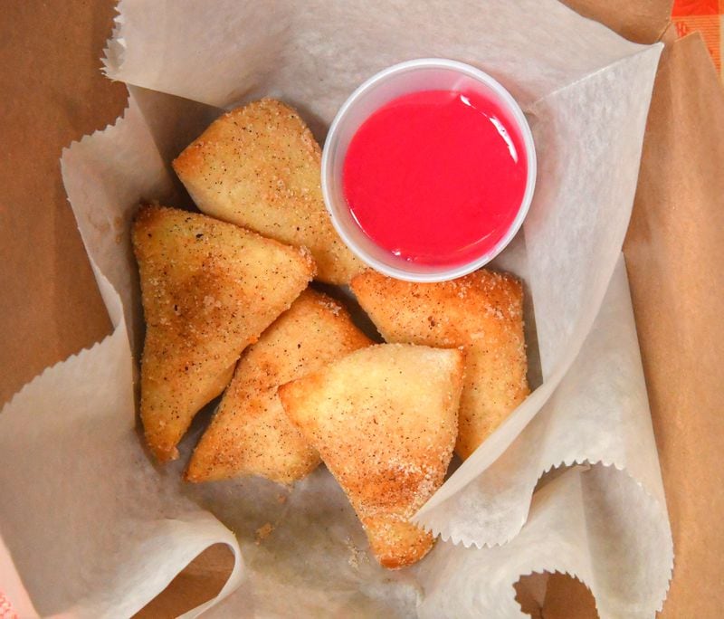 Doritas, from Dolo's Pizza, are sweet fried dough tossed in cinnamon-sugar and served with hibiscus icing. Chris Hunt for The Atlanta Journal-Constitution