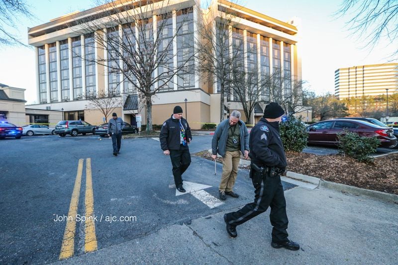 Authorities investigated a shooting Friday involving an FBI agent. JOHN SPINK / JSPINK@AJC.COM