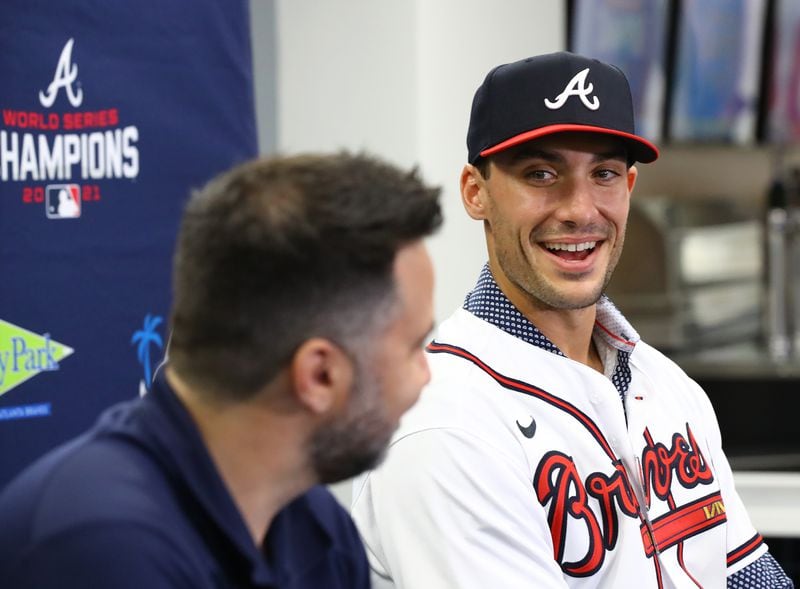 Newly acquired All-Star first baseman Matt Olson, who signed an eight-year, $168 million deal that runs through the 2029 season, is all smiles as he is introduced by Braves general manager Alex Anthopoulos on Tuesday in North Port, Fla. (Curtis Compton/The Atlanta Journal-Constitution/TNS)