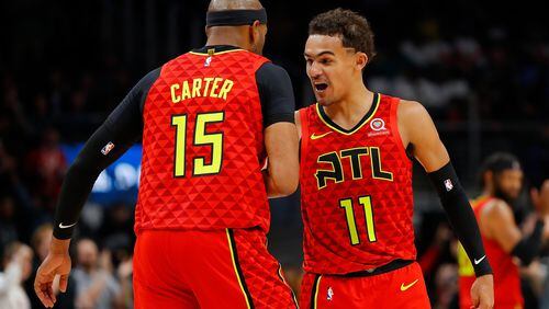 Trae Young #11 of the Atlanta Hawks celebrates after a shot by Vince Carter #15 in the second half against the San Antonio Spurs.  (Photo by Kevin C. Cox/Getty Images)