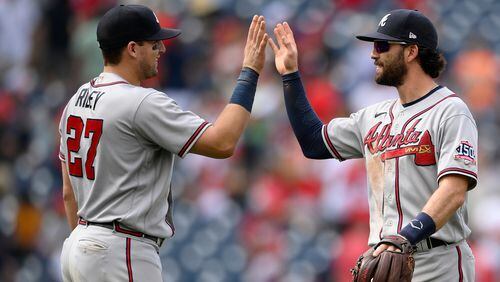 Fellow infielders Austin Riley and Dansby Swanson enjoy the Braves 6-5 win over the Washington Nationals Sunday. (Nick Wass/AP)