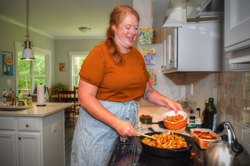 Jessica Rothacker prepares a bowl of her Summer Farm Box Vegetable Hash in her Athens home. It's a great dish for a brunch and a great way to use up extra veggies. CONTRIBUTED BY CHRIS HUNT PHOTOGRAPHY