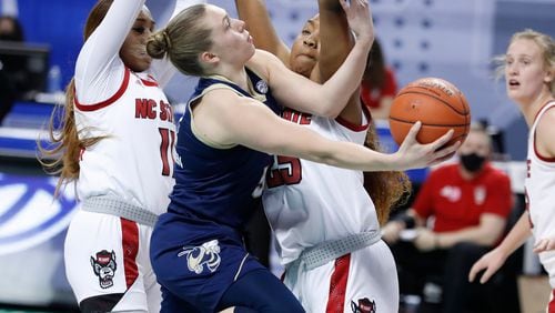 Georgia Tech's Lotta-Maj Lahtinen (31) shoots as North Carolina State's Kayla Jones (25) during the first half of an NCAA college basketball game in the semifinals of Atlantic Coast Conference tournament in Greensboro, N.C., Saturday, March 6, 2021. (Ethan Human/The News & Observer via AP)