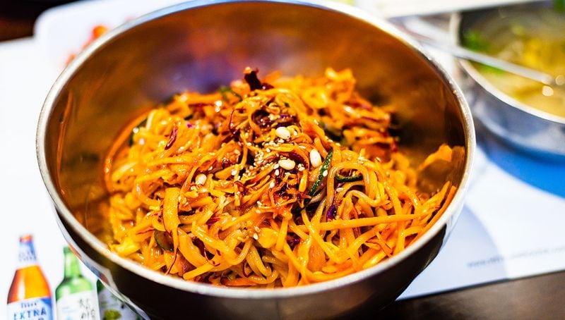 ASIAN NOODLES: The Korean dish of Jjolmeyon, or spicy chewy noodles, at Yet Tuh on Buford Highway are served cold and tossed with shredded cabbage, carrots, garlic and bean sprouts.
