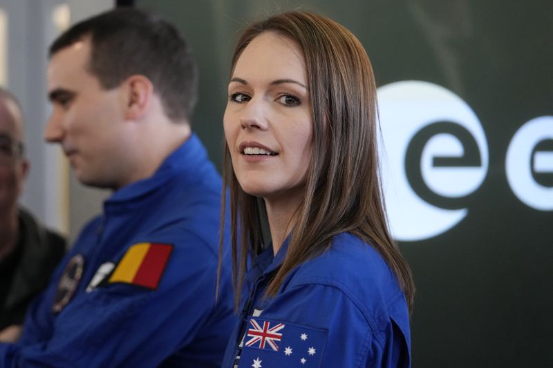 Astronaut Katherine Bennell-Pegg of Australia smiles during the candidates of the Class of 2022 graduation ceremony at the European Astronaut Centre in Cologne, Germany, Monday, April 22, 2024. ESA astronaut candidates Sophie Adenot of France, Pablo Alvarez Fernandez of Spain, Rosemary Coogan of Britain, Raphael Liegeois of Belgium and Marco Sieber of Switzerland took up duty at the European Astronaut Centre one year ago to be trained to the highest level of standards as specified by the International Space Station partners. Also concluding a year of astronaut basic training is Australian astronaut candidate Katherine Bennell-Pegg, who has trained alongside ESA's candidates. (AP Photo/Martin Meissner)