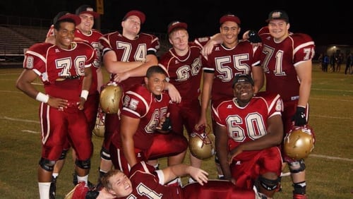 Former Brookwood Broncos football player Kyle Gregory (No. 60) poses with teammates, including Griffen Perkins (No. 74) and Joe Kelly (No. 71).