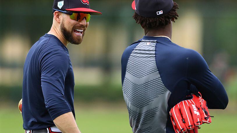 Atlanta Braves outfielder Ender Inciarte shares a laugh with Ronald Acuna while working in the outfield during spring training Wednesday, Feb. 20, 2019, at the ESPN Wide World of Sports Complex in Lake Buena Vista, Fla.