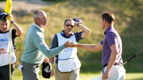 Matt Kuchar of the United States fist bumps Victor Perez of France after winning 2&1 in the third place round of the World Golf Championships-Dell Technologies Match Play at Austin Country Club on March 28, 2021 in Austin, Texas. (Photo by Darren Carroll/Getty Images)