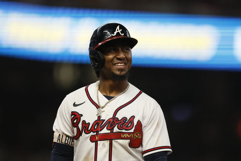 Braves second baseman Ozzie Albies reacts after hitting a single during the fourth inning against the Philadelphia Phillies at Truist Park, Saturday, September 17, 2022, in Atlanta. (Jason Getz / Jason.Getz@ajc.com)
