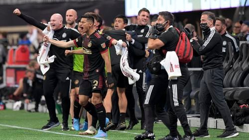 Atlanta United players and staff react to midfielder Jake Mulraney’s game winning goal against Charlotte FC during an MLS game Sunday, March 13, 2020 in Atlanta. (Daniel Varnado/For the Atlanta Journal-Constitution)