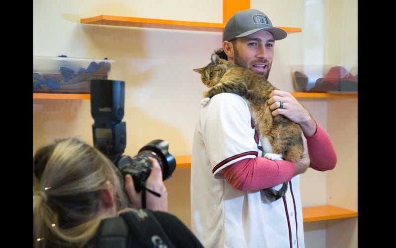 The Atlanta Braves baseball player Charlie Culberson was photographed as he played with a cat as he visited Best Friends in Atlanta as part of the team's Season of Giving on Wednesday, Dec. 12, 2018. The animal shelter works collaboratively with area shelters, animal welfare organizations and individuals to save the lives of pets in shelters in the South. (Photo by Phil Skinner)