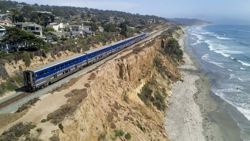 A Surfliner train by Amtrak travels along the collapsing bluffs in Del Mar, California. (John Gibbins/The San Diego Union-Tribune/TNS)