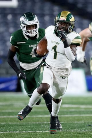 Dec. 30, 2020 - Atlanta, Ga: Grayson wide receiver Jamal Haynes (1) runs after a catch against Collins Hill defensive back Justin Richardson (4) in the first half during the Class 7A state high school football final at Center Parc Stadium Wednesday, December 30, 2020 in Atlanta. JASON GETZ FOR THE ATLANTA JOURNAL-CONSTITUTION