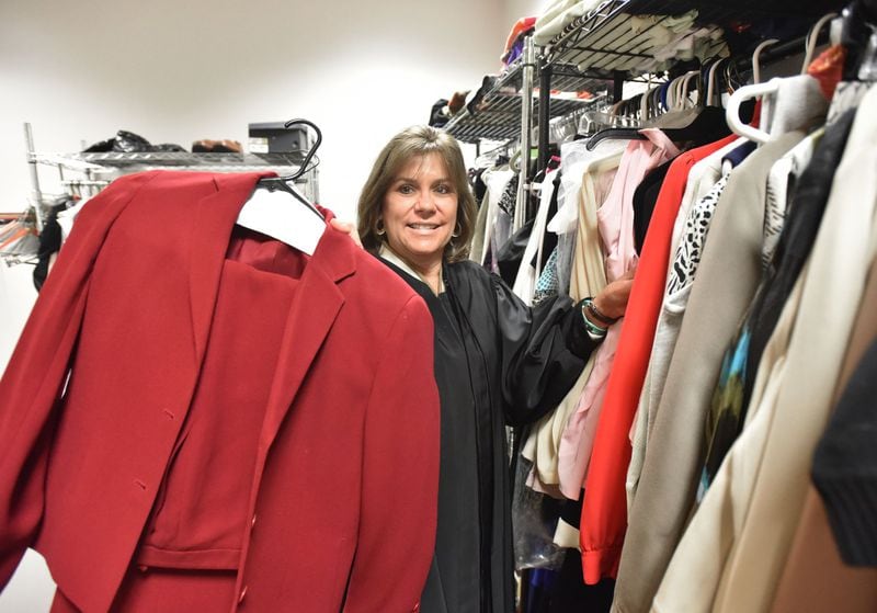 November 20, 2018 Atlanta - Superior Court Judge Shawn LaGrua shows off clothing, her program participants can borrow, so they can wear for their job interview at Fulton County Superior Court in Atlanta on Tuesday, November 20, 2018. Fulton County Judge Shawn LaGrua doesn’t take the easy cases for her My Journey Matters program. HYOSUB SHIN / HSHIN@AJC.COM