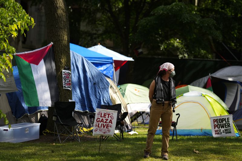 A person stands at a Gaza Solidarity Encampment at the University of Pennsylvania in Philadelphia, Wednesday, May 1, 2024. (AP Photo/Matt Rourke)