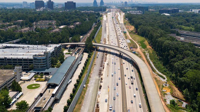 The Georgia Department of Transportation plans to build toll lanes on Ga. 400 in Fulton and Forsyth counties. It's one of several projects that will be delayed as GDOT reshuffles its construction timeline in metro Atlanta.  Aerial photo shows Ga. 400 (L-Northbound, R-Southbound). North Springs MARTA station is shown on left. (File photo by Hyosub Shin / Hyosub.Shin@ajc.com)