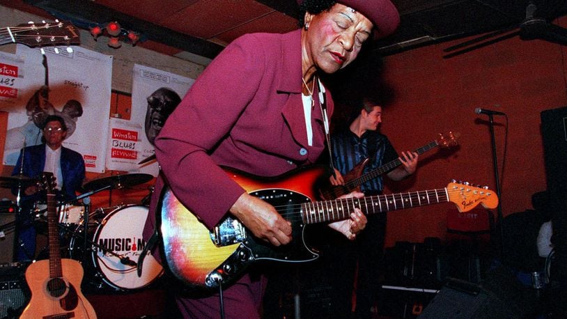 Beverly ‘Guitar’ Watkins performed in Chicago in 1998, in Chicago. Backing her up is drummer Artie Dean, left, and bass guitarist, right, is Jon Schwenke. (AP Photo/Stephen J. Carrera)