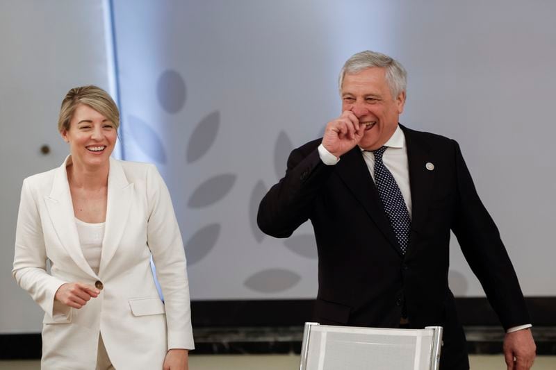 Canadian Minister of Foreign Affairs Melanie Joly, left, and Italian Foreign Minister Antonio Tajani react during a meeting on the second day of a G7 foreign ministers meeting on Capri island, Italy, Thursday April 18, 2024. (Remo Casilli/Pool via AP)