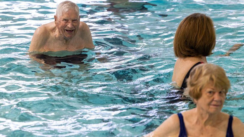 A 104-year-old WWII veteran, Charlie Duncan (upper left) does water aerobics three days a week at the Mountain View Aquatic Center in east Cobb. PHIL SKINNER FOR THE ATLANTA JOURNAL-CONSTITUTION 