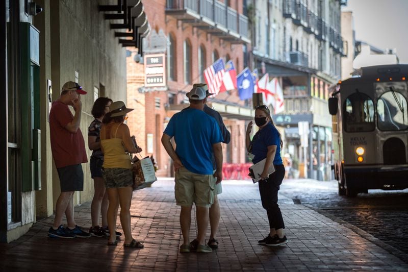 SAVANNAH, GA - Sept. 4, 2020: CoVid Resource Team member Nicole Bush, right, reminds a group of people to wear masks while visiting River Street in historic downtown Savannah. (AJC Photo/Stephen B. Morton)