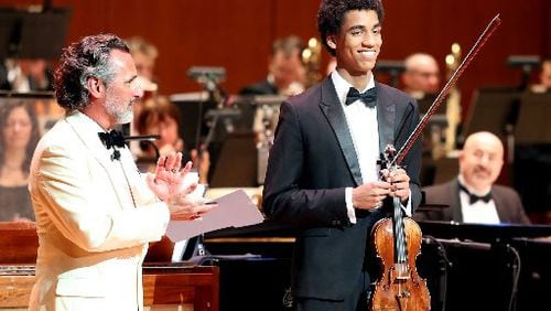 ASO president and CEO Stanley Romanstein introduced 17-year-old violin prodigy Keanu Mitanga, a member of the ASO Talent and Development Program, in a March concert. Romanstein resigned on Monday.