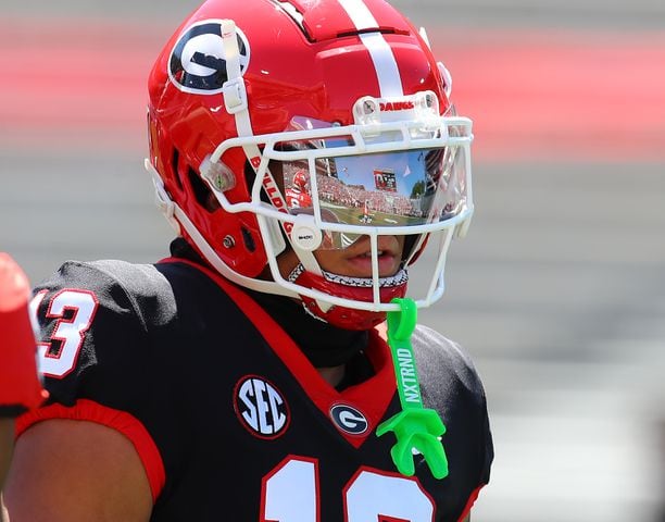 Sanford Stadium is reflected in the face mask of wide receiver Michael Jackson III during the G-Day game on Saturday, April 13, 2024.  Curtis Compton for the Atlanta Journal Constitution