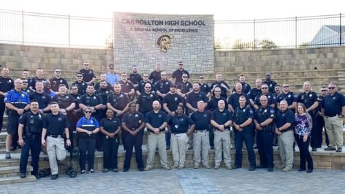 More than three dozen members of the Carrollton Police Department attended a senior honors night in the place of Sgt. Rob Holloway, who is still in the intensive care unit at Grady Memorial Hospital.