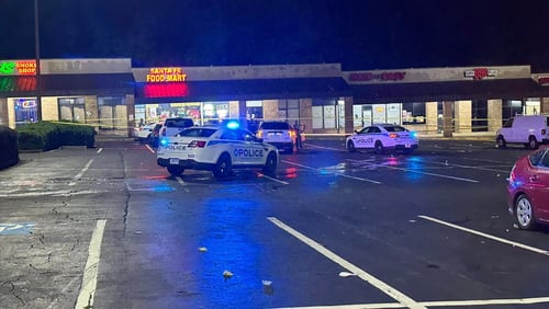 A man was found shot to death at a strip mall in Gwinnett County on Sunday morning, police said.