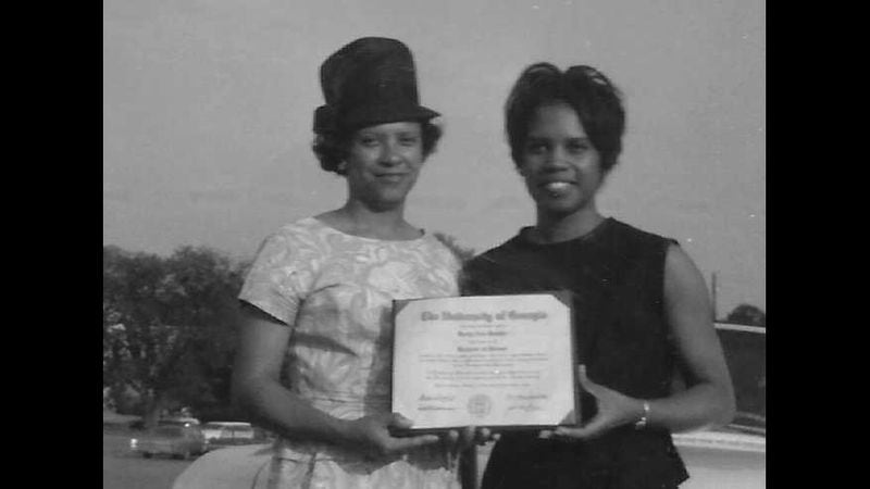 Kerry Rushin, right, held her diploma as she stood next to her mother, Annie Lee Rushin, after the 1966 commencement ceremony. She was one of the first Black students to graduate from the University of Georgia. FAMILY PHOTO.