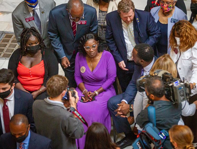 Wanda Cooper-Jones is surrounded by media after the signing of HB 479, which repeals Georgia's citizen's arrest law at the State Capital Monday, May 10, 2021.  STEVE SCHAEFER FOR THE ATLANTA JOURNAL-CONSTITUTION