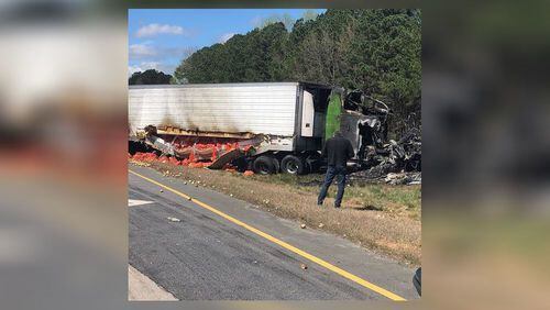 A busy  Gwinnett County road was shut down for hours Saturday after a tractor-trailer carrying a load of Vidalia onions crashed into another truck and caught fire, police said.