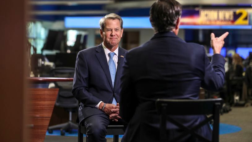 Governor Brian Kemp (left) sits with Anchor Justin Farmer (right) for a one-on-one interview on Channel 2 Action News in Atlanta on Wednesday, Nov. 9, 2022. (John Spink / John.Spink@ajc.com)