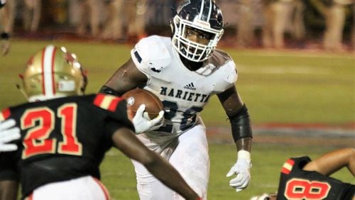Marietta's Kimani Vidal runs the ball down field toward Rome's Trey Lawrence during the second quarter of Thursday's game at Barron Stadium in Rome. (Jeremy Stewart/Special)