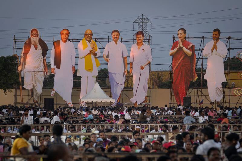 Giant cutouts of opposition political party leaders tower over supporters during a rally, on the outskirts of the southern Indian city of Chennai, April 15, 2024. (AP Photo/Altaf Qadri)