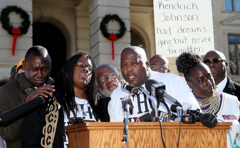 Jackie and Kenny Johnson (center) speak during a “Who Killed K.J.” rally for their son Kendrick Johnson in Atlanta in December 2013. PHIL SKINNER / PSKINNER@AJC.COM