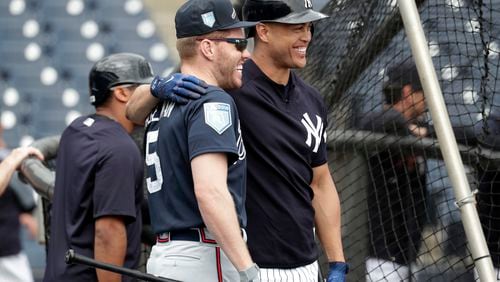 Freddie Freeman (left) chats with Yankees slugger Giancarlo Stanton before a March 2 game at Tampa, Fla. (AP Photo/Lynne Sladky)