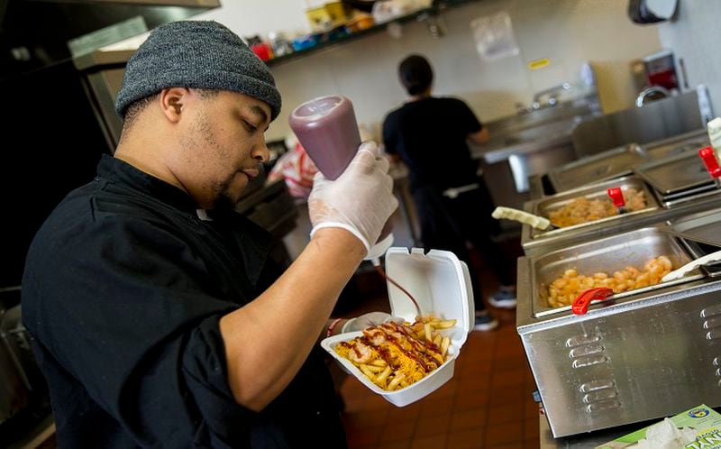 Craig Batiste, aka "Mr. Fries Man," is photographed inside his new restaurant on March 24, 2017 in Gardena, Calif. Starting out as a pop-up, Batiste would post on Instagram, receive orders and set-up around Gardena for patrons to pick up orders. A food-truck was short-lived, catching fire only after owning it for a couple months (Jay L. Clendenin/Los Angeles Times/TNS)