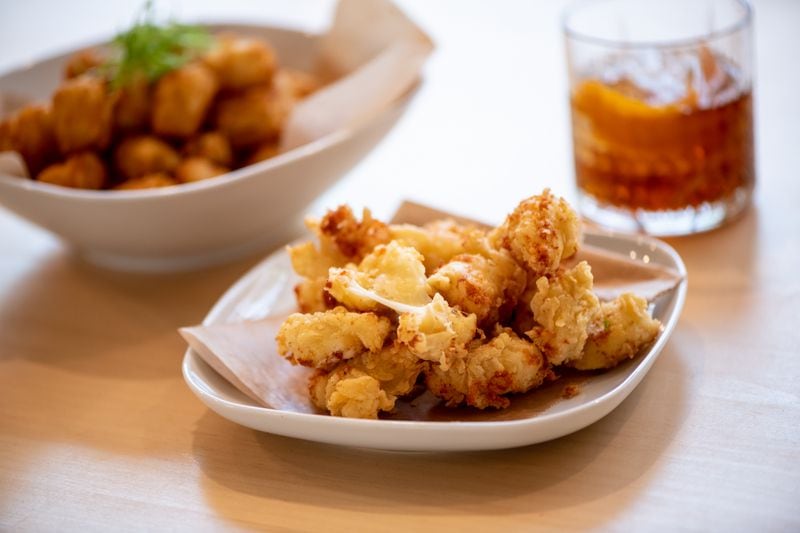 The Abby Singer's Deep Fried Cheese Curds are representative of a menu marked by fried foods and lots of cheese. (Mia Yakel for The Atlanta Journal-Constitution)