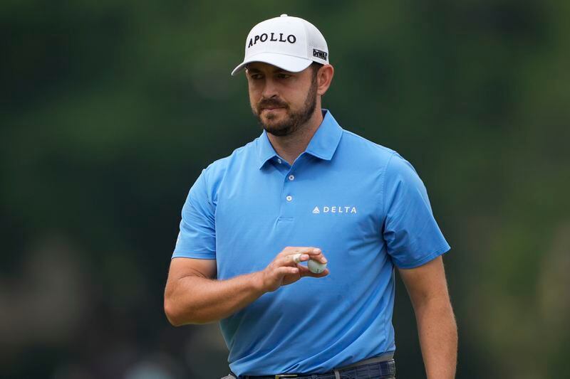 Patrick Cantlay waves after making a putt on the fifth hole during the first round of the RBC Heritage golf tournament, Friday, April 19, 2024, in Hilton Head Island, S.C. (AP Photo/Chris Carlson)