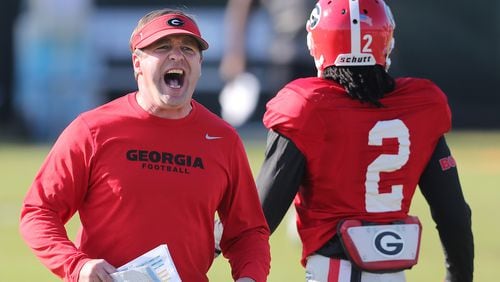 Georgia head coach Kirby Smart keeps things moving while making a point to players during team practice for the Rose Bowl.