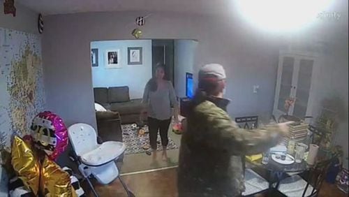 A surveillance camera in a woman's home caught a stranger walking into her home.